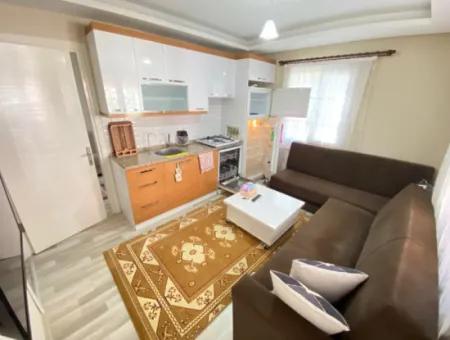 2 1 Apartment With Ground Floor Garden For Sale In Seferihisar Ürkmez Center